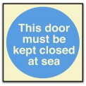 THIS DOOR MUST BE KEPT CLOSED AT SEA
